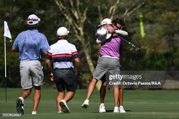 Altin Van Der Merwe of South Africa reacts on the 18th green with Jordan Burnand of South Africa following his victory during a playoff during day...