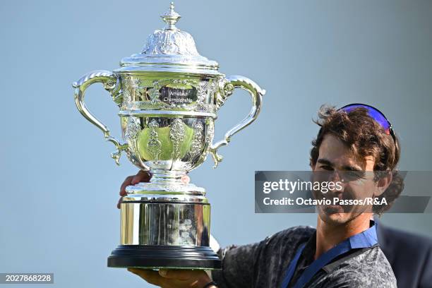 Altin Van Der Merwe of South Africa holds the trophy following his victory in a playoff during day four of the Africa Amateur Championship and...