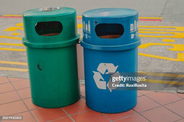 two public ecological garbage cans in the city of singapore. - color coded stock pictures, royalty-free photos & images