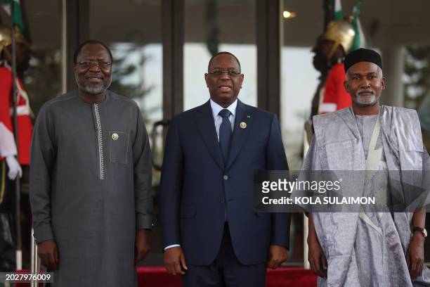 Senegal President, Macky Sall is welcomed by President of Economic Community of West African States Commission , Omar Touray and Nigerian Minister of...