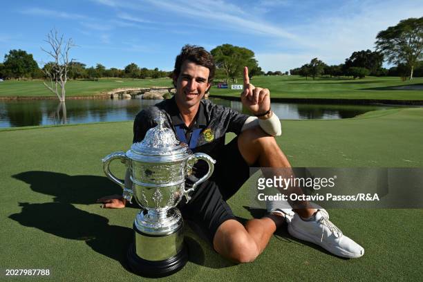Altin Van Der Merwe of South Africa poses with the trophy following his victory in a playoff during day four of the Africa Amateur Championship and...