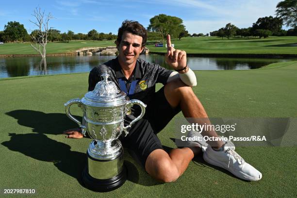 Altin Van Der Merwe of South Africa poses with the trophy following his victory in a playoff during day four of the Africa Amateur Championship and...