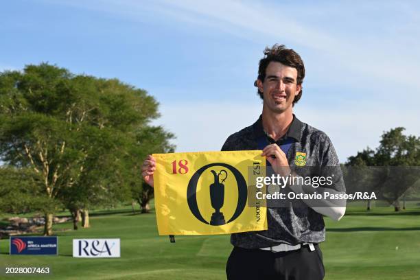 Altin Van Der Merwe of South Africa poses with an Open Championship flag following his victory in a playoff during day four of the Africa Amateur...