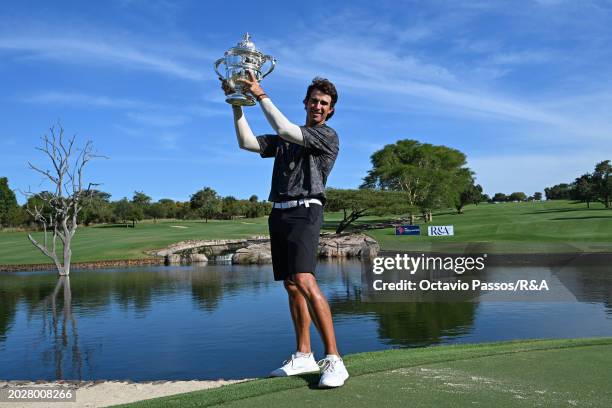 Altin Van Der Merwe of South Africa poses with the trophy following his victory in a playoff during day four of the Africa Amateur Championship and...