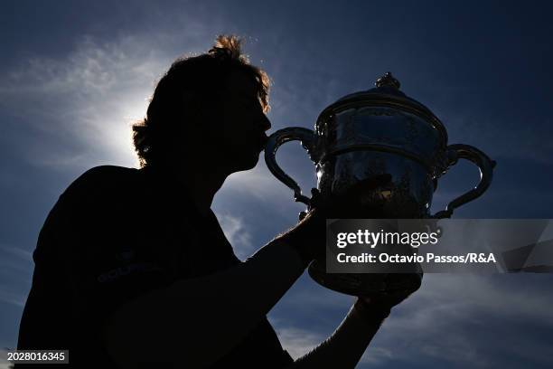 Altin Van Der Merwe of South Africa kisses the trophy following his victory in a playoff during day four of the Africa Amateur Championship and...