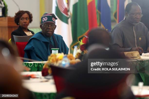 Nigeria's President and Chairman, Economic Community of West African States Commission Bola Tinubu, looks on during the extraordinary session of...