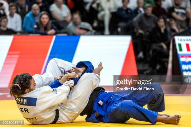 Twice European champion, Alina Boehm of Germany traps the linked arms of World and European medalist, Fanny Estelle Posvite of France between her...