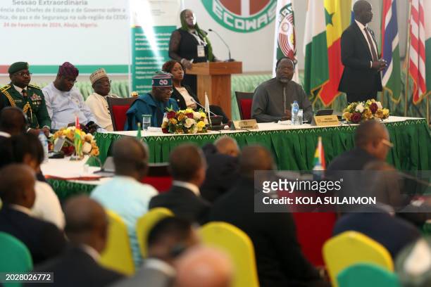 Nigeria's President and Chairman, Economic Community of West African States Commission Bola Tinubu, looks on during the extraordinary session of...