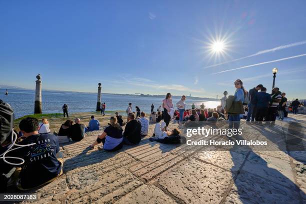 Visitors crowd Cais das Colunas in Terreiro do Paço by the Tagus River, a favorite tourist spot, on February 19 in Lisbon, Portugal. Tourism...