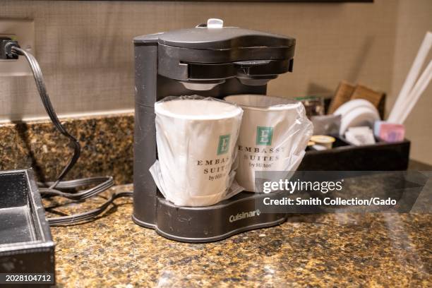 Logo for Embassy Suites on hotel coffee maker in hotel room interior, Walnut Creek, California, January 27, 2023.