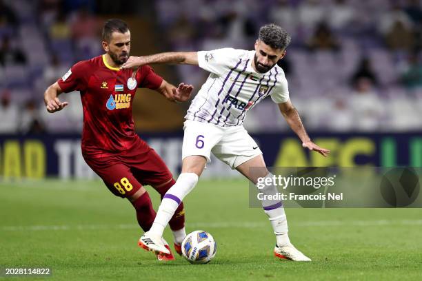 Yahia Nader of Al Ain controls the ball whilst under pressure from Marko Stanojevic of FC Nasaf during the second leg of the AFC Champions Leauge...