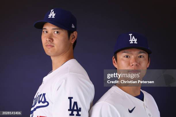 Shohei Ohtani and Yoshinobu Yamamoto of the Los Angeles Dodgers pose for a portrait during photo day at Camelback Ranch on February 21, 2024 in...