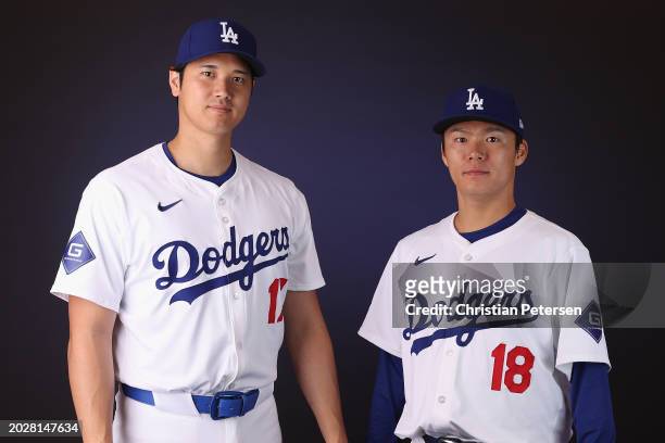 Shohei Ohtani and Yoshinobu Yamamoto of the Los Angeles Dodgers pose for a portrait during photo day at Camelback Ranch on February 21, 2024 in...