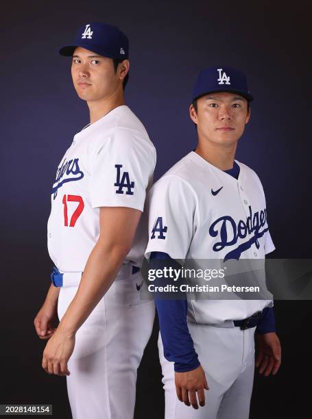 Shohei Ohtani and Yoshinobu Yamamoto of the Los Angeles Dodgers pose for a portrait during photo day at Camelback Ranch on February 21, 2024 in...