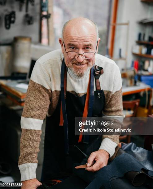 portrait of a senior man in hi workshop - grey belt stock pictures, royalty-free photos & images