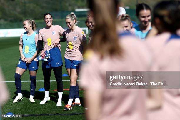 Beth Mead, Mary Earps, Alessia Russo and teammates of England react during a training session at La Quinta Football Center on February 21, 2024 in...