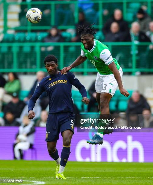 Hibernian's Rocky Bushiri and Dundee's Amadou Bakayoko in action during a cinch Premiership match between Hibernian and Dundee at Easter Road...