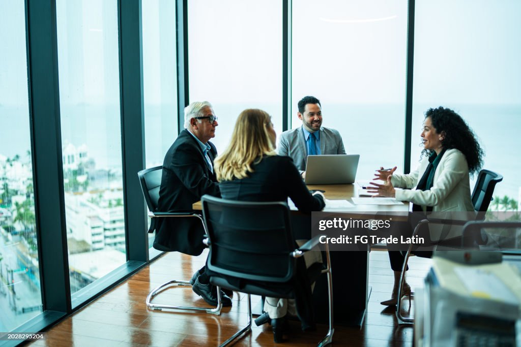 Coworkers talking on business meeting on office