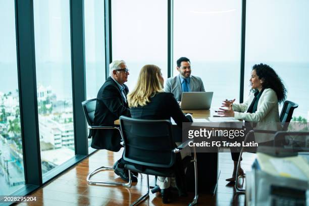 coworkers talking on business meeting on office - business  stock pictures, royalty-free photos & images