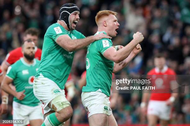 Ireland's number 8 Caelan Doris and Ireland's full back Ciaran Frawley celebrate after Frawley's try during the Six Nations international rugby union...