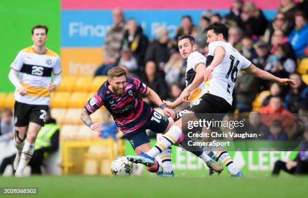 Lincoln City's Ted Bishop battles with Port Vale's Ben Garrity, centre, and Jason Lowe during the Sky Bet League One match between Port Vale and...