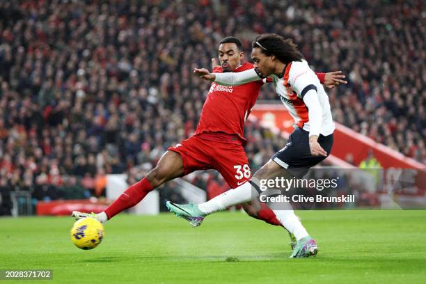 Tahith Chong of Luton Town has a shot saved by Caoimhin Kelleher of Liverpool before Chiedozie Ogbene of Luton Town scores his team's first goal...