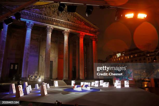 Coffins of Missak Manouchian and his wife Mélinee Manouchian lay outside the Pantheon monument as images are projected during the induction ceremony...