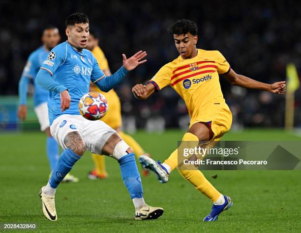 Lamine Yamal of FC Barcelona clears the ball whilst under pressure from Mathias Olivera of SSC Napoli during the UEFA Champions League 2023/24 round...