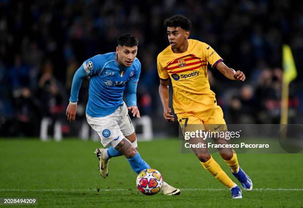 Lamine Yamal of FC Barcelona runs with the ball whilst under pressure from Mathias Olivera of SSC Napoli during the UEFA Champions League 2023/24...