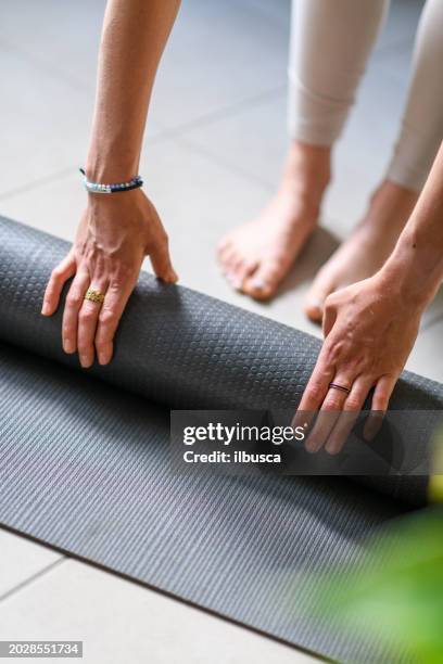woman practicing yoga at home - yoga block stock pictures, royalty-free photos & images