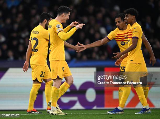 Robert Lewandowski of FC Barcelona celebrates with Lamine Yamal after scoring his team's first goal during the UEFA Champions League 2023/24 round of...