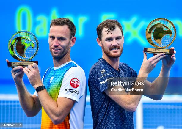 Jamie Murray from Great Britain and Michael Venus from New Zealand are posing with their trophy after winning the doubles final match against Lorenzo...