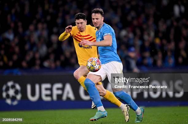 Amir Rrahmani of SSC Napoli battles for possession with Robert Lewandowski of FC Barcelona during the UEFA Champions League 2023/24 round of 16 first...
