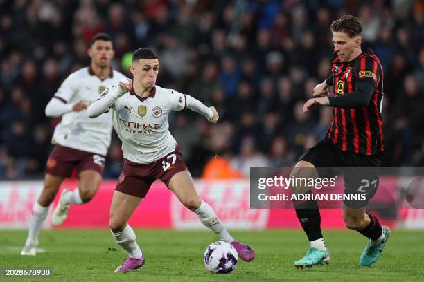 Manchester City's English midfielder Phil Foden vies with Bournemouth's Ukrainian defender Illia Zabarnyi during the English Premier League football...