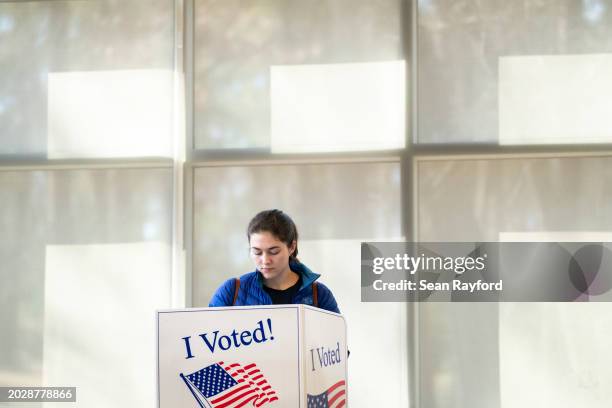 Voter looks over their ballot at Earlewood Park during the South Carolina Republican presidential primary on February 24, 2024 in Columbia, South...