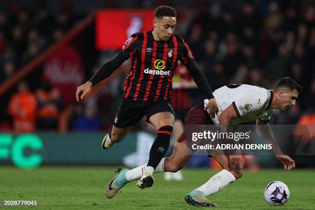 Manchester City's Spanish midfielder Rodri is fouled by Bournemouth's English midfielder Marcus Tavernier during the English Premier League football...