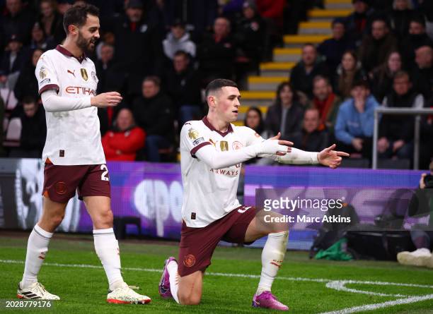 Phil Foden of Manchester City celebrates scoring the first goal with Bernardo Silva during the Premier League match between AFC Bournemouth and...