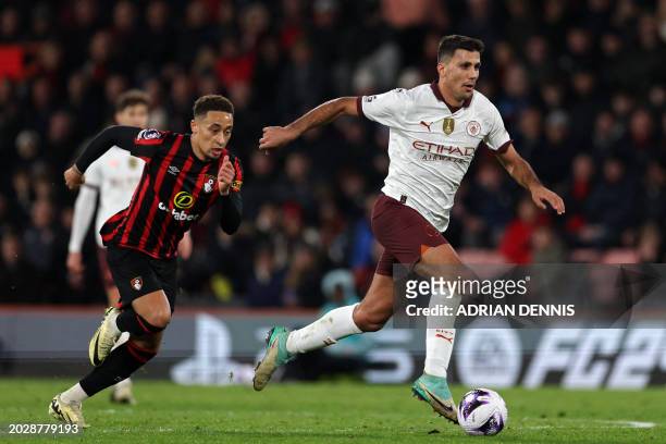 Manchester City's Spanish midfielder Rodri runs with the ball during the English Premier League football match between Bournemouth and Manchester...