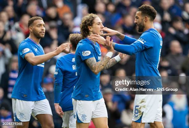 Rangers' Fabio Silva celebrates with Connor Goldson after making it 5-0 during a cinch Premiership match between Rangers and Heart of Midlothian at...