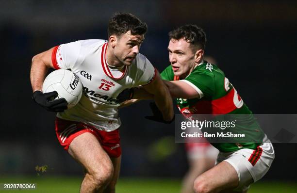 Northern Ireland , United Kingdom - 24 February 2024; Darren McCurry of Tyrone in action against Michael Plunkett of Mayo during the Allianz Football...