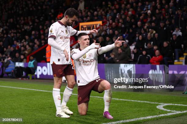 Phil Foden of Manchester City celebrates their first goal with Bernardo Silva of Manchester City during the Premier League match between AFC...