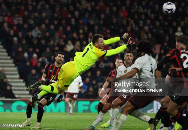 Bournemouth's Brazilian goalkeeper Neto punches the ball clear during the English Premier League football match between Bournemouth and Manchester...