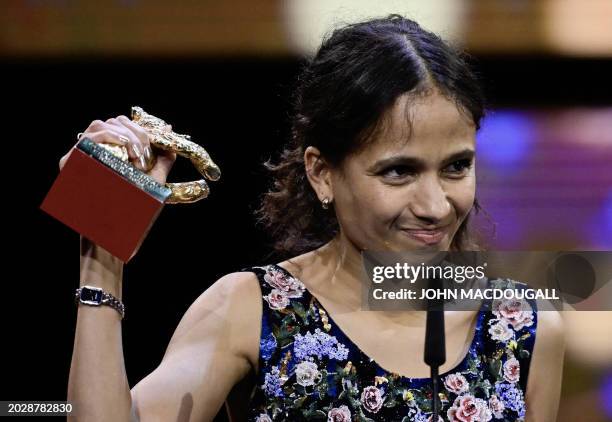 French-Senegalese filmmaker and actress Mati Diop celebrats with the Golden Bear for Best Film for the film "Dahomey" on stage during the awards...