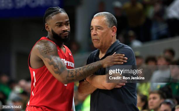 Jamal Shead of the Houston Cougars congratulates his head coach Kelvin Sampson in the final seconds of the team's victory over the Baylor Bears in...