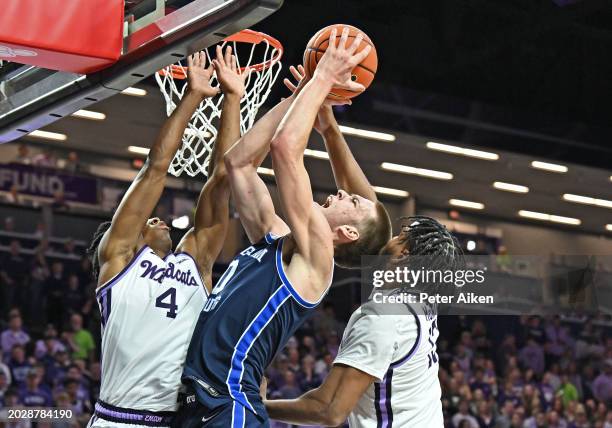 Noah Waterman of the Brigham Young Cougars goes to the basket against Dai Dai Ames of the Kansas State Wildcats in the first half at Bramlage...