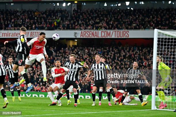 Newcastle United's German goalkeeper Loris Karius saves this header from Arsenal's Brazilian defender Gabriel Magalhaes in the build-up to an...