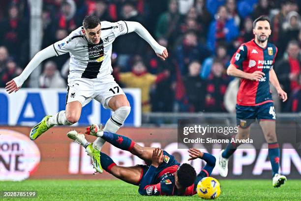Lorenzo Lucca of Udinese and Koni De Winter of Genoa vie for the ball during the Serie A TIM match between Genoa CFC and Udinese Calcio at Stadio...