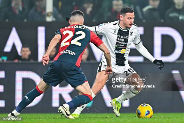 Johan Vasquez of Genoa and Florian Thauvin of Udinese vie for the ball during the Serie A TIM match between Genoa CFC and Udinese Calcio at Stadio...
