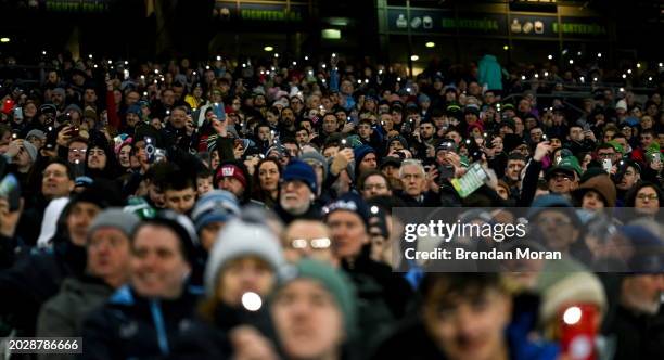 Dublin , Ireland - 24 February 2024; Supporters use the torch on their phones to shine a light for hope during 'Light Up Croke Park for Peace in...