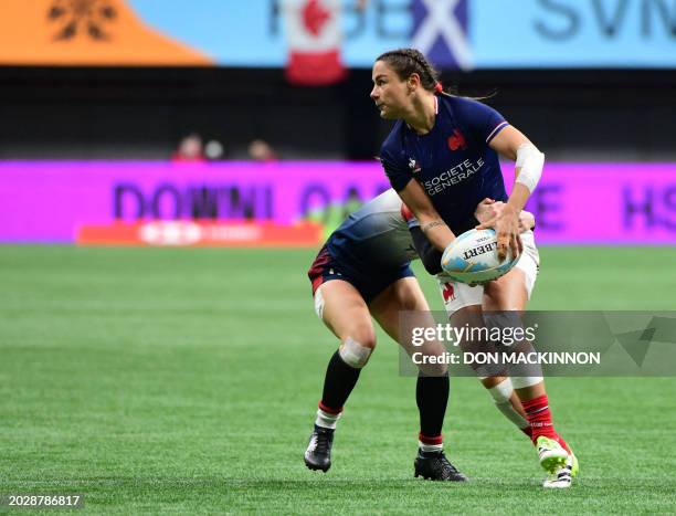 France's Valentine Lothoz controls the ball against Great Britain during the HSBC SVNS Vancouver tournament in Vancouver, BC, Canada, on February 24,...